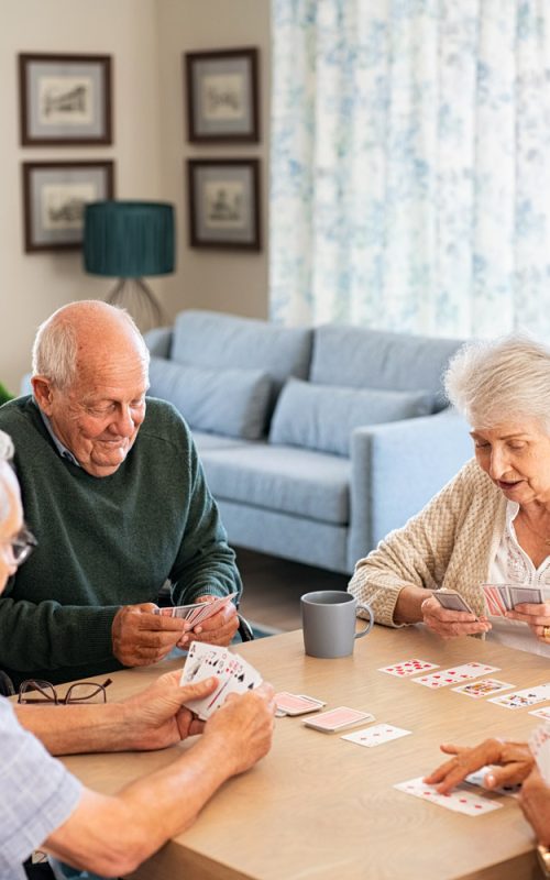 A group of seniors playing cards together.
